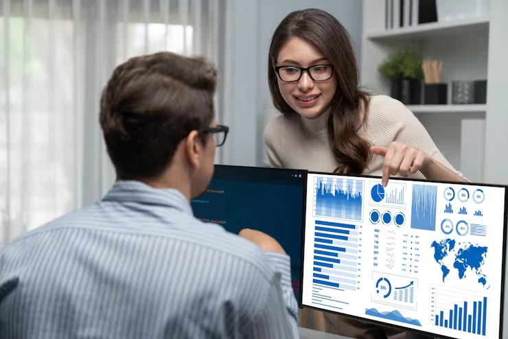 Woman discussing data with man