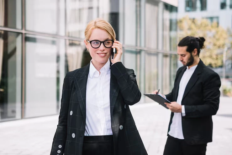 A Confident Business Professional Making A Cold Call Outside A Modern Vancouver Office Building