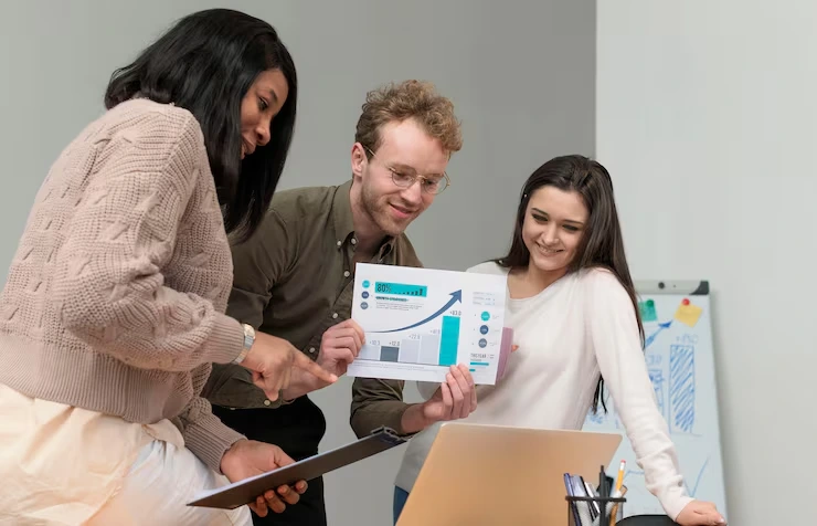 A team reviewing lead generation reports and growth charts in an office meeting