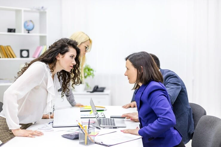 A team of professionals discussing a fundraising campaign strategy around a office table