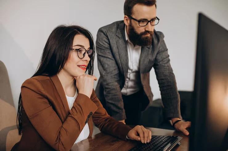 professional team on laptops in office